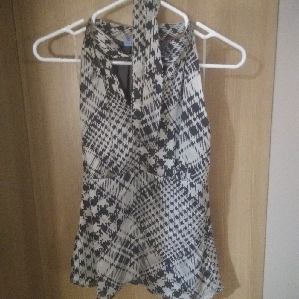 Top fully lined. Sleeveless high back low front